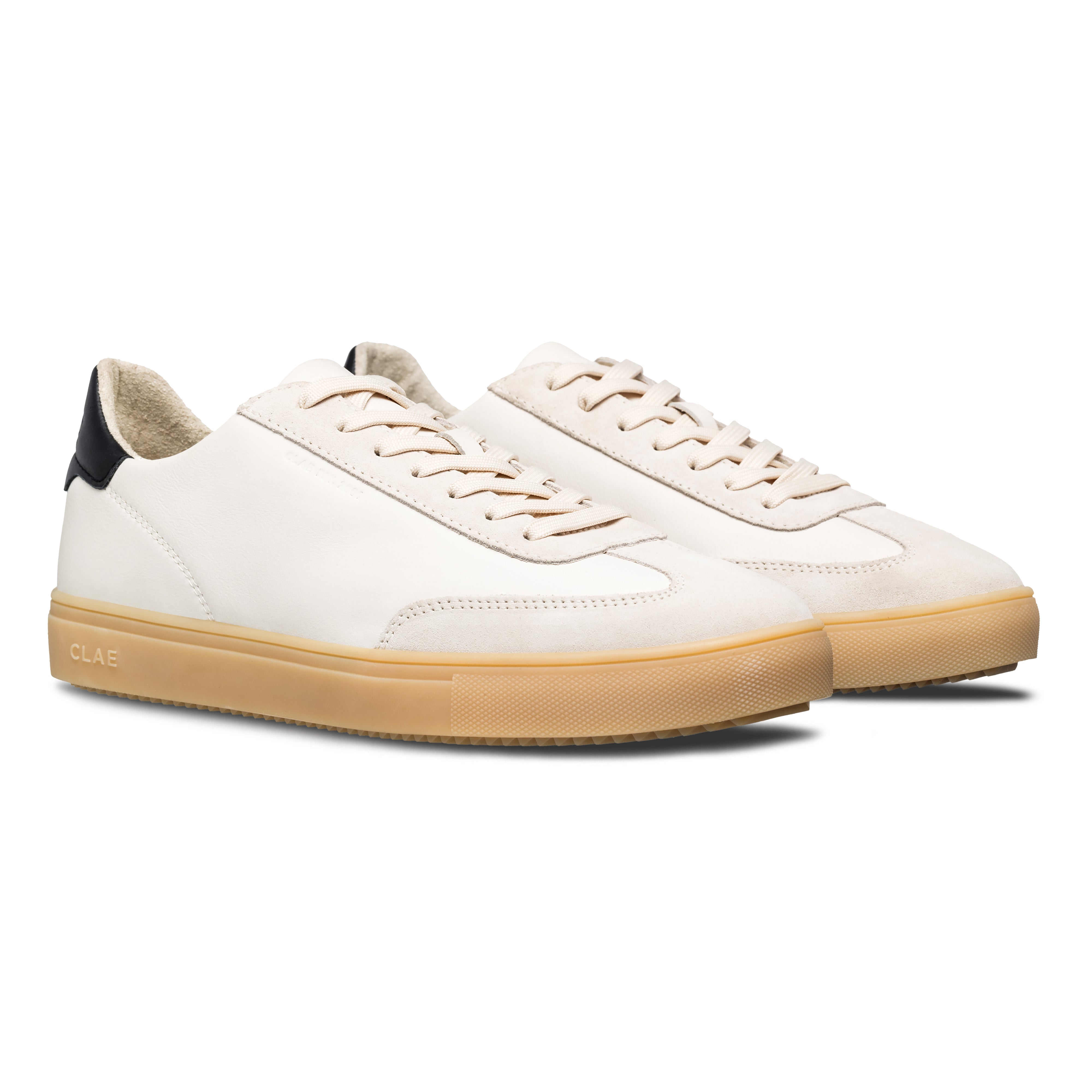 Three-quarter view of Deane court shoe in Off-White Black Light Nat Gum, highlighting sophisticated blend of materials and modern heritage design.