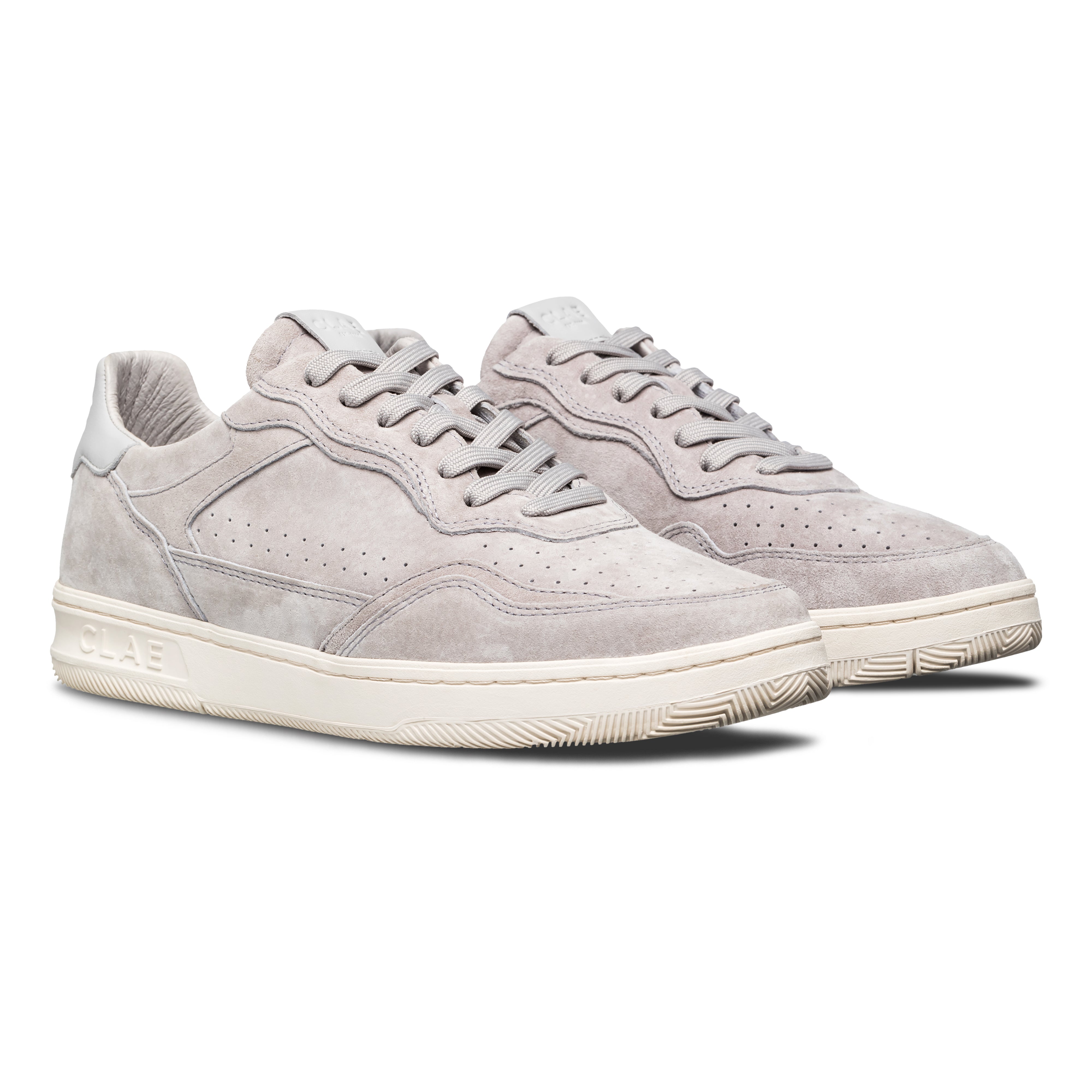 Three-quarter view of Haywood court shoe in Quiet Gray Suede, highlighting all-leather construction and premium finish.