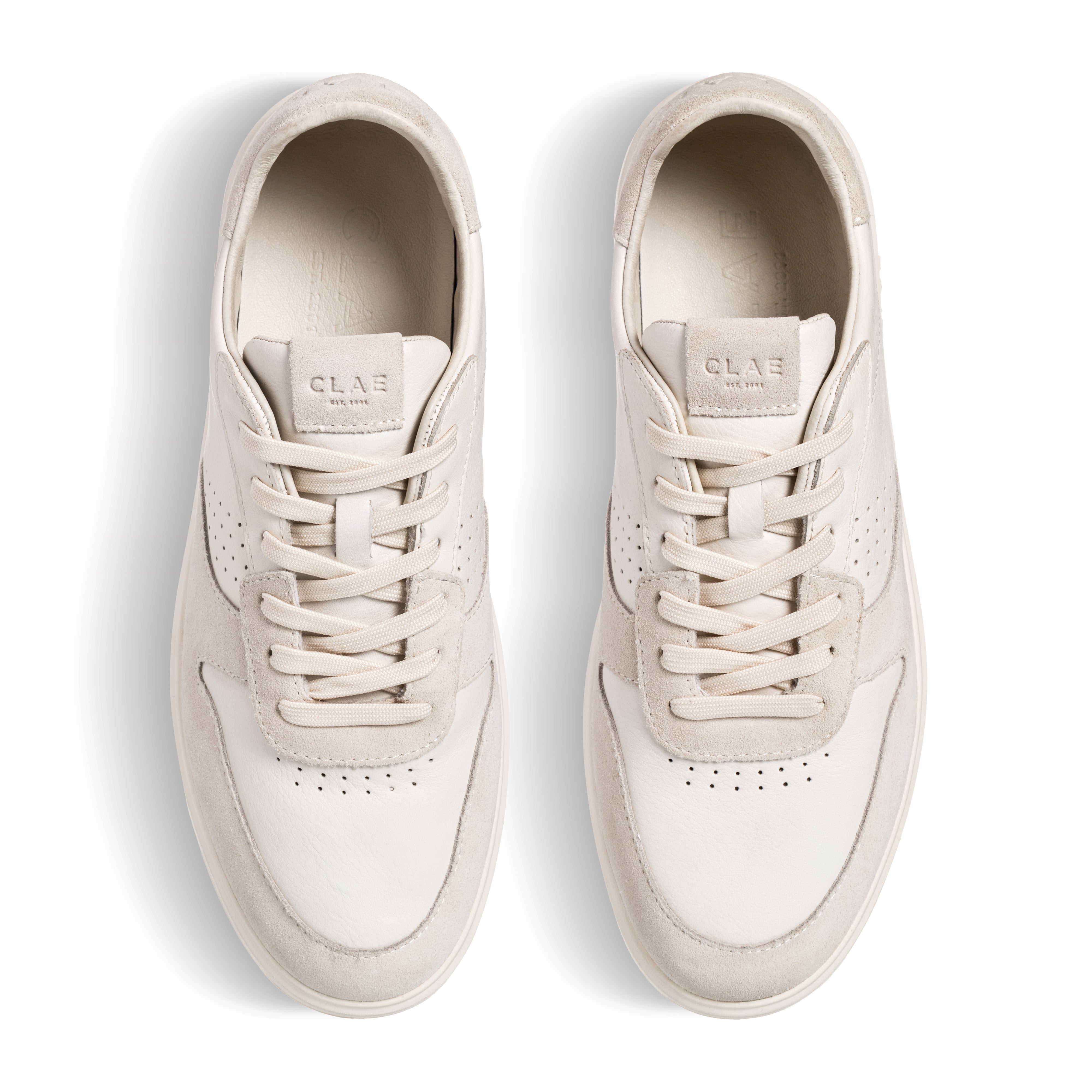 Top view of Moses sneaker in Triple Off-White, showing Italian leather and suede upper with sleek court-style design.