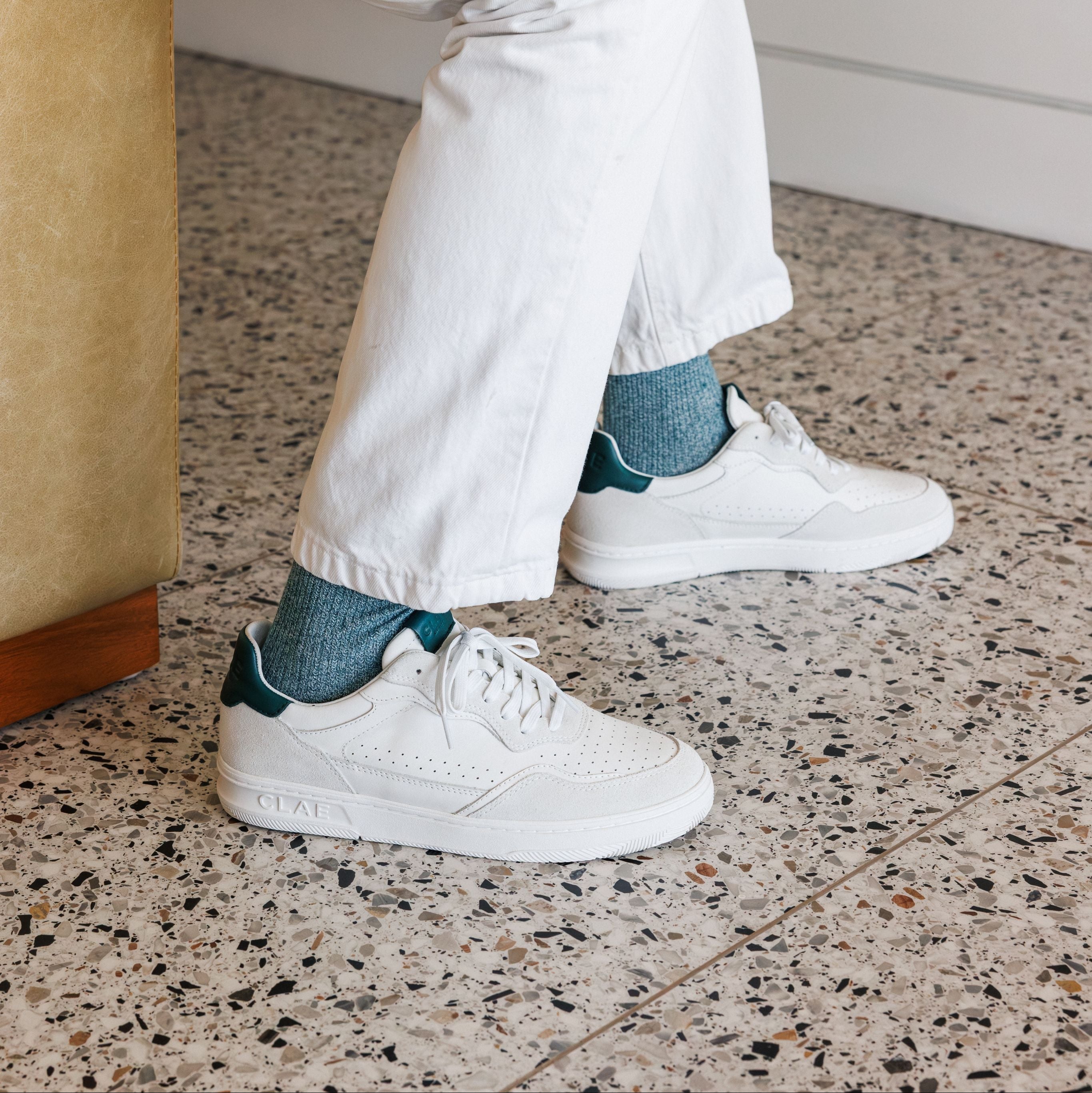 Haywood court shoe in White Pine Needle worn in casual lifestyle setting, highlighting premium materials and refined detailing.