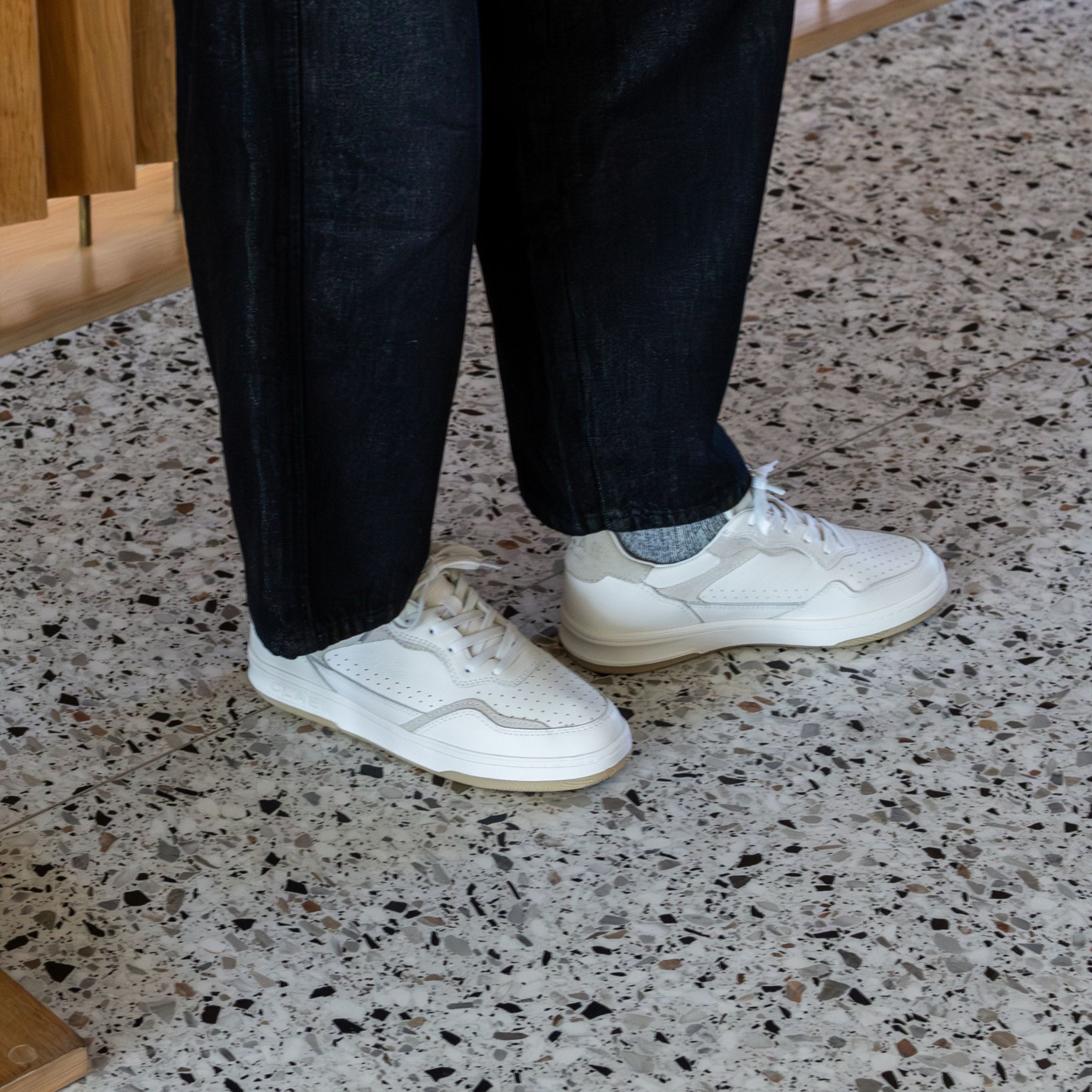 Haywood court shoe in White Wood Ash worn in casual lifestyle setting, highlighting premium materials and refined detailing.